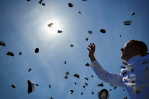 Midshipmen Toss Thier Hats During Graduation Ceremony